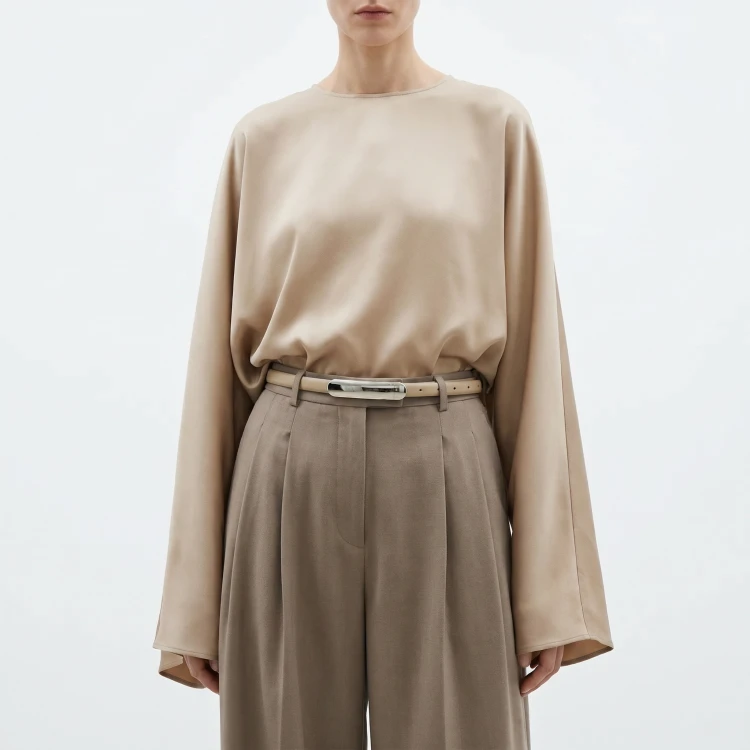 Generated with Kive.ai - need photo to sell those belts_ frame from the neck to the tighs. minimalist outfit in earth colours_ but no green_ made of luxury fabrics like wool silk_ outfits more for spring summer than autumn winter. white (2).png