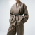 Generated with Kive.ai - need photo to sell those belts_ frame from the neck to the tighs. minimalist outfit in earth colours_ but no green_ made of luxury fabrics like wool silk_ outfits more for spring summer than autumn winter. whit (11).png