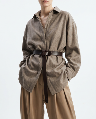 Generated with Kive.ai - i need photo to sell those belts_ frame from the neck to the tighs. minimalist outfit in earth colours_ but no green_ made of luxury fabrics like wool silk_ outfits more for spring summer than autumn winter. whi (4).png