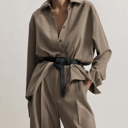Generated with Kive.ai - need photo to sell those belts_ frame from the neck to the tighs. minimalist outfit in earth colours_ but no green_ made of luxury fabrics like wool silk_ outfits more for spring summer than autumn winter. whit (15).png