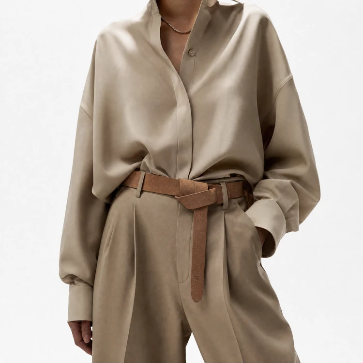 Generated with Kive.ai - need photo to sell those belts_ frame from the neck to the tighs. minimalist outfit in earth colours_ but no green_ made of luxury fabrics like wool silk_ outfits more for spring summer than autumn winter. whit (19).png