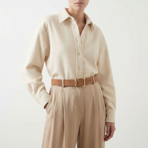 Generated with Kive.ai - need photo to sell those belts_ frame from the neck to the tighs. minimalist outfit in earth colours_ but no green_ made of luxury fabrics like wool silk_ outfits more for spring summer than autumn winter. whit (21).png