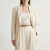 Generated with Kive.ai - need photo to sell those belts_ frame from the neck to the tighs. minimalist outfit in earth colours_ but no green_ made of luxury fabrics like wool silk_ outfits more for spring summer than autumn winter. whit (32).png